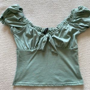 Mint green blouse.